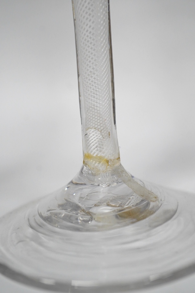 Three DSOT stem drinking glasses, c.1760, tallest 18.5 cm high. Condition - the ale glass - tiny splinter chip to the under edge of base, the wine glass with round funnel - good condition, the wine glass with a bell bowl